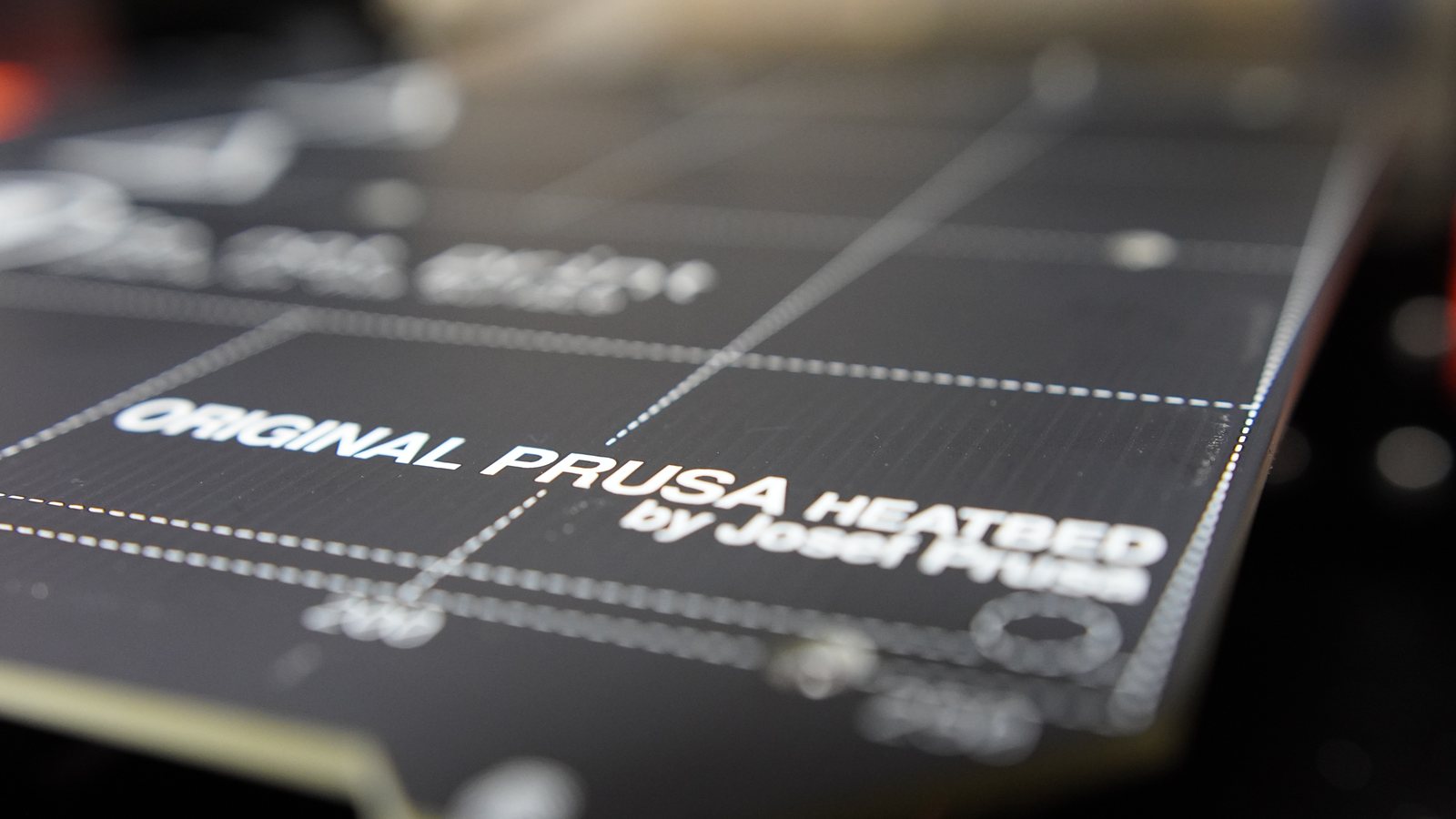 Shallow focus close-up of the Original Prusa heatbed print surface.