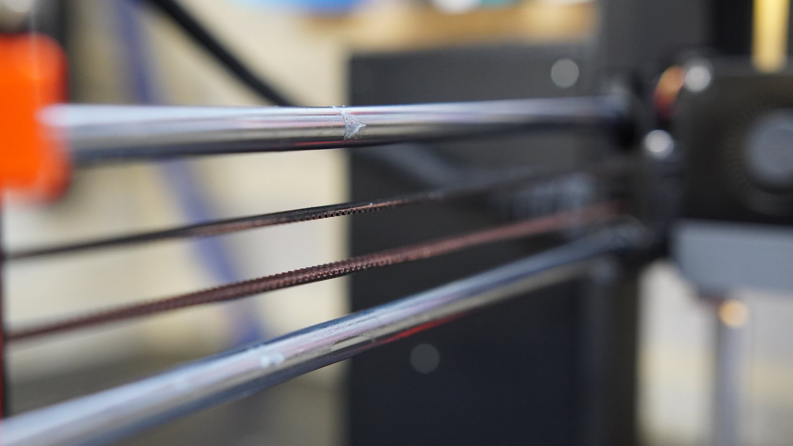 Close-up along the Prusa MK4 rods and belt.