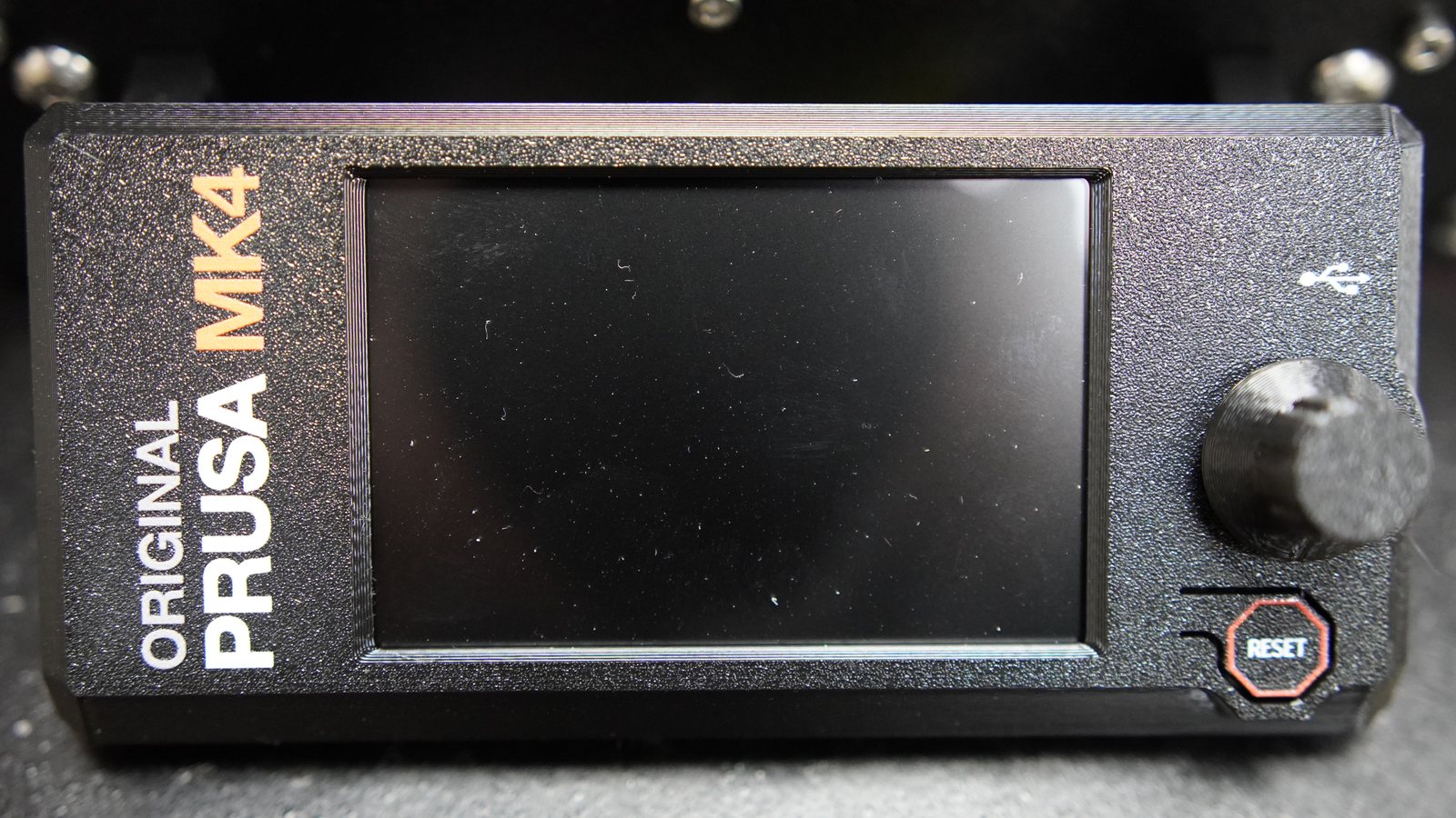 Close-up of the Prusa MK4 control display and reset button.