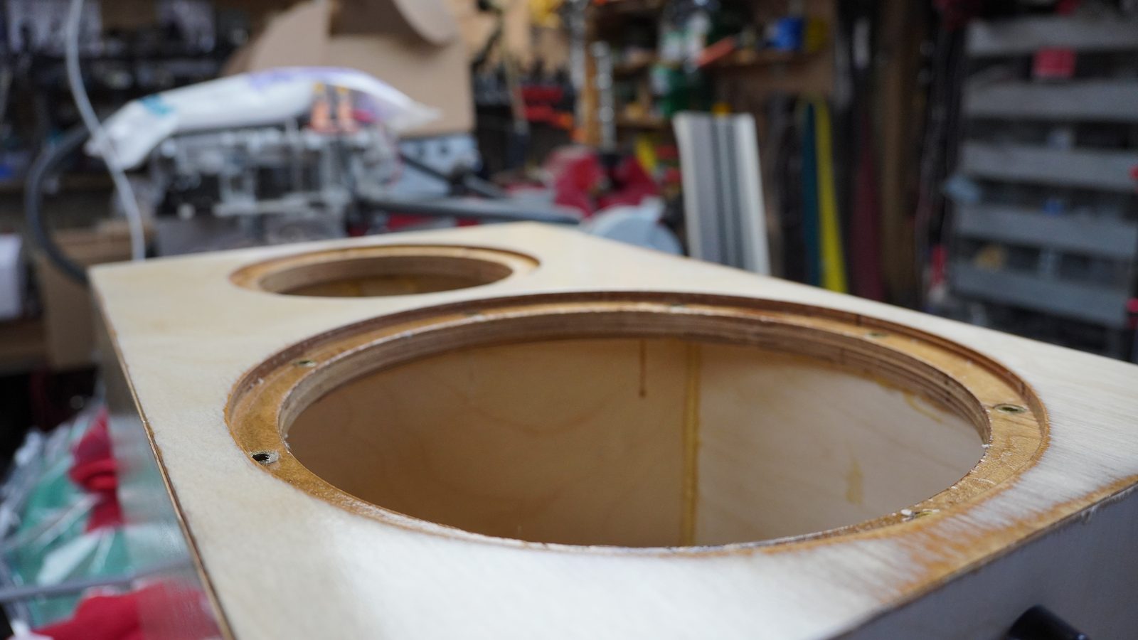 Close view of a routed circular driver rebate in the plywood baffle.
