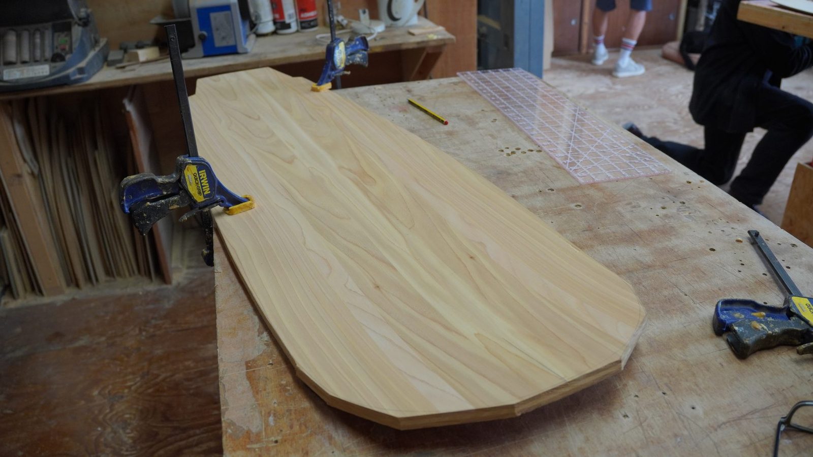 A wooden belly board on a workbench during the making course.