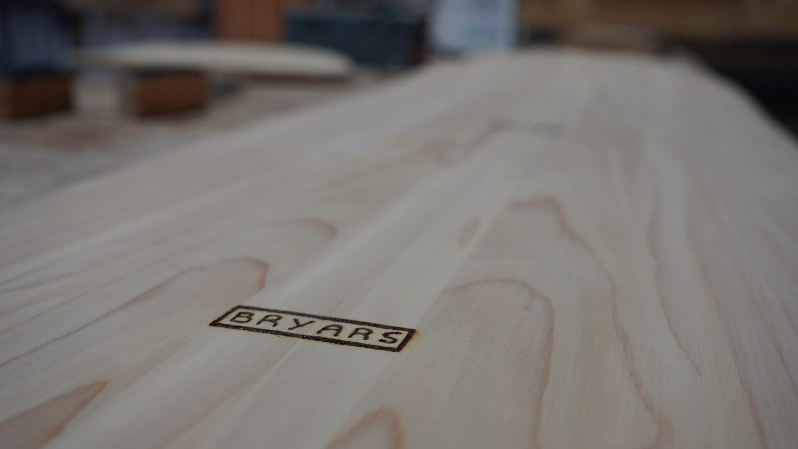 Close view of the finished wooden belly board grain.