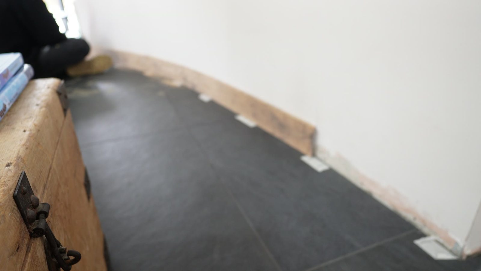 Curved skirting board offered up against the curved wall.