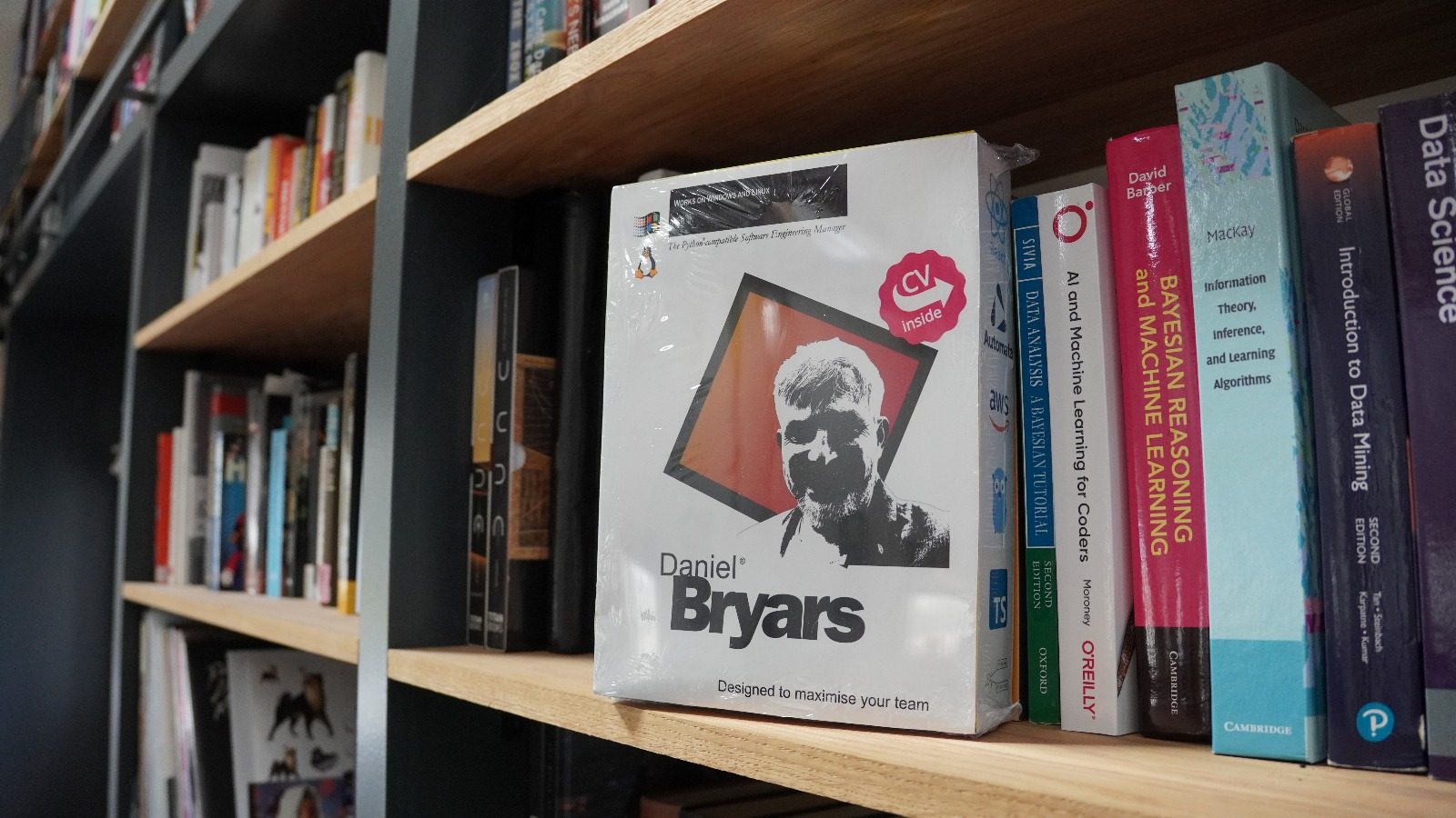A CV packaged like a 1990s boxed software product, on a bookshelf.