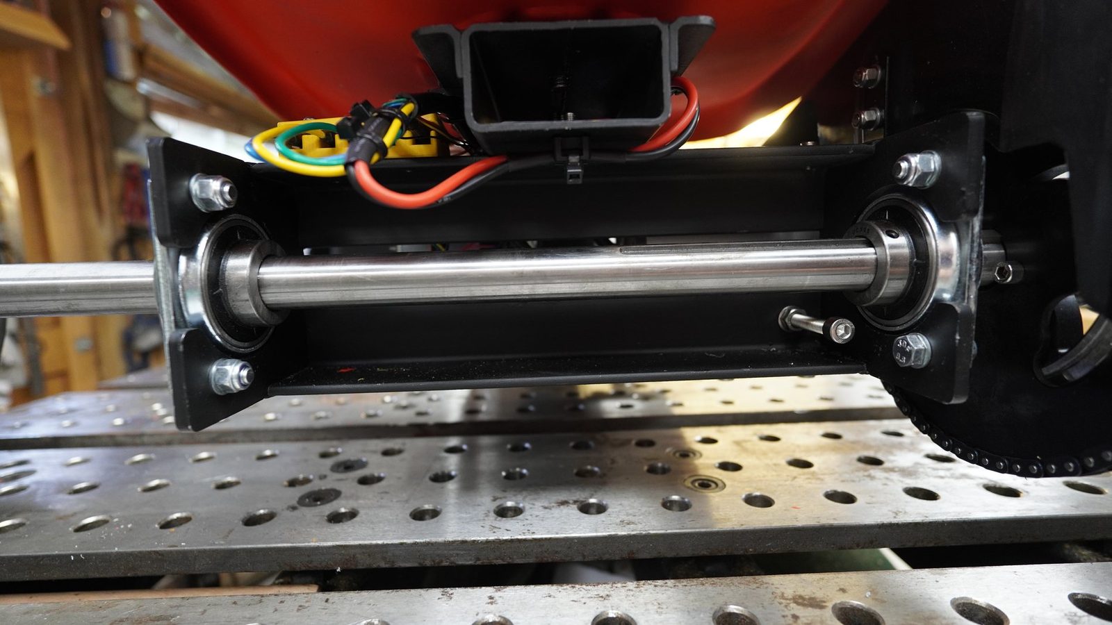 Close view of axle bearing hardware on the drift trike.