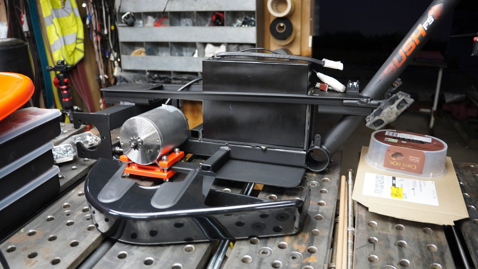 Drift trike frame parts on a welding table.
