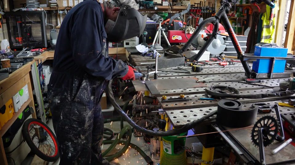 Plasma cutting a drift trike frame part.
