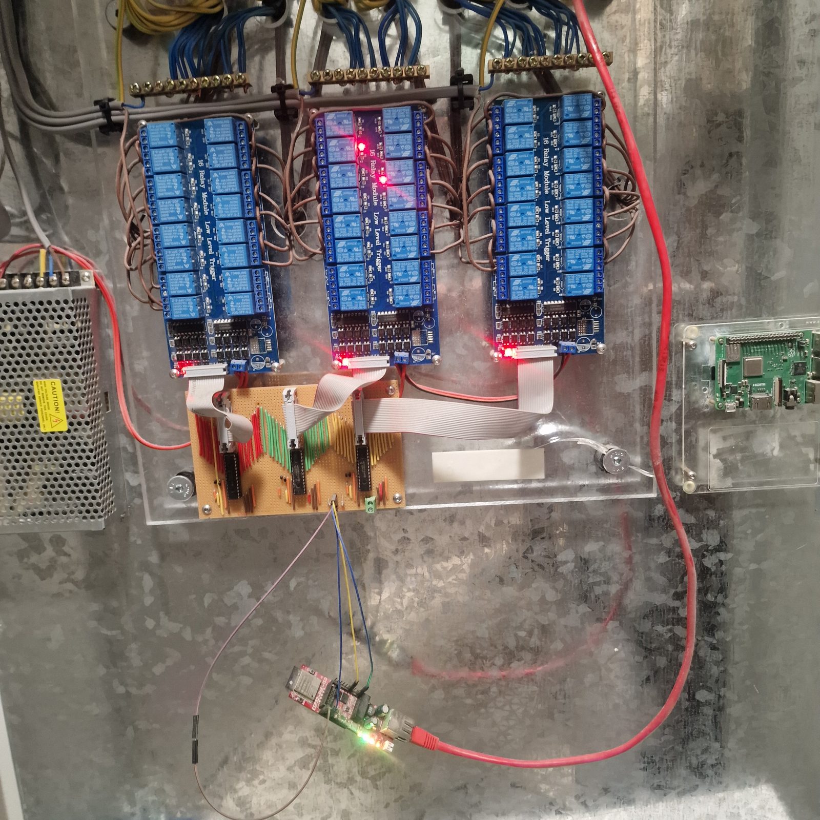 Close view of relay-panel wiring used for Home Assistant lighting control.