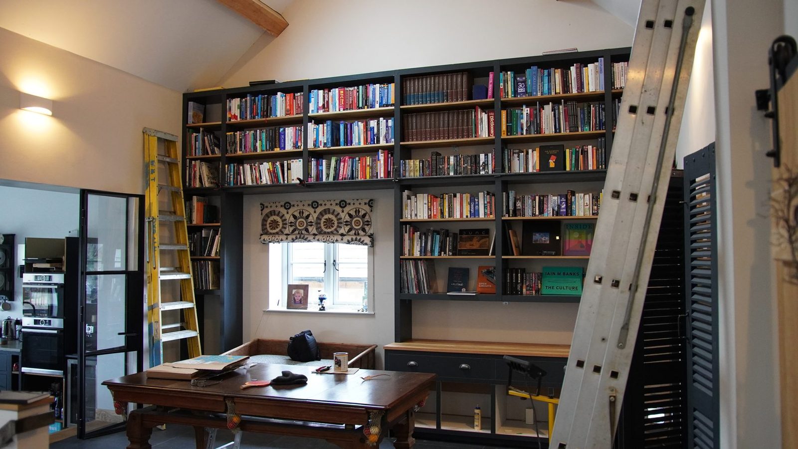 Closer view of the loaded custom bookcase.