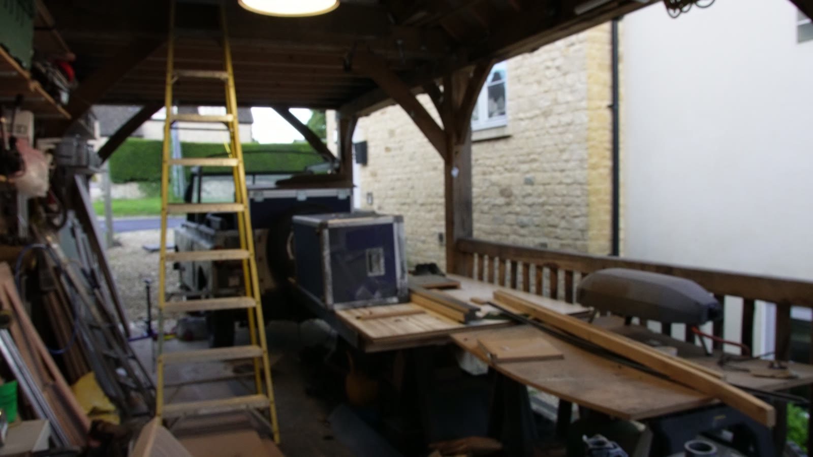 Rolling ladder parts and timber laid out in the workshop.