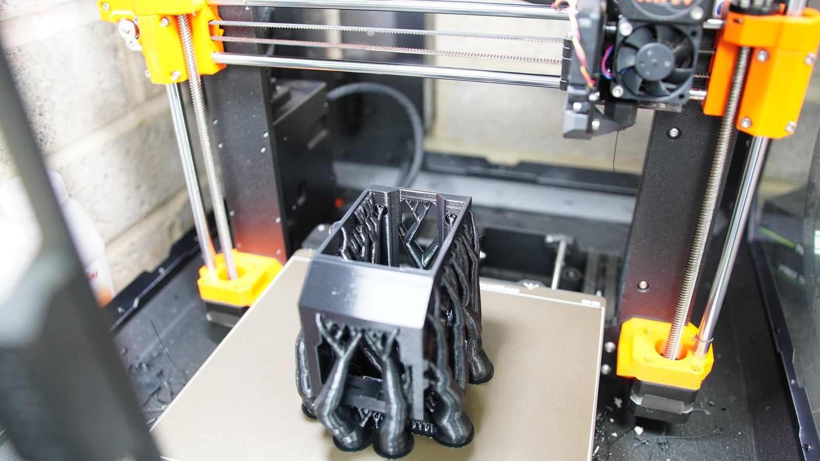 3D printer making robot arm components.