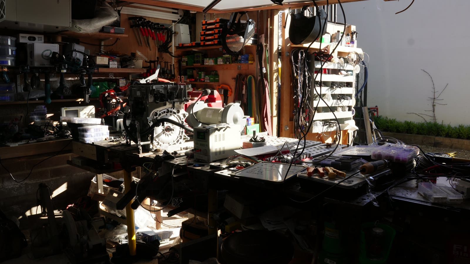 Workshop view of the robot arm A-axis build in progress.