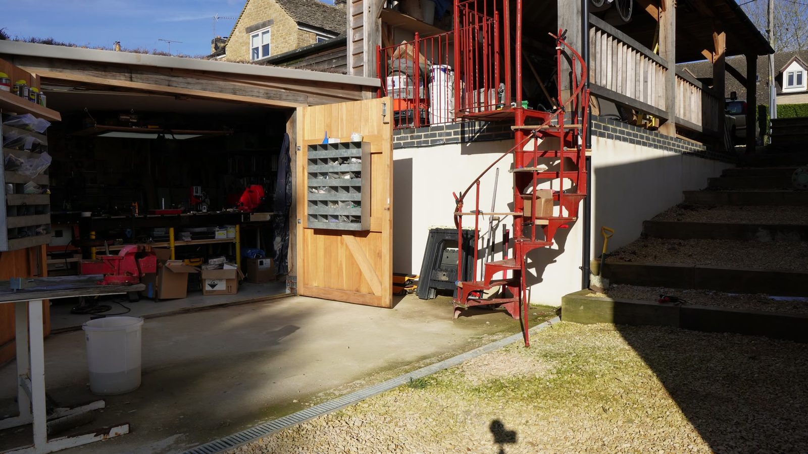 Red spiral staircase in the courtyard before finishing.