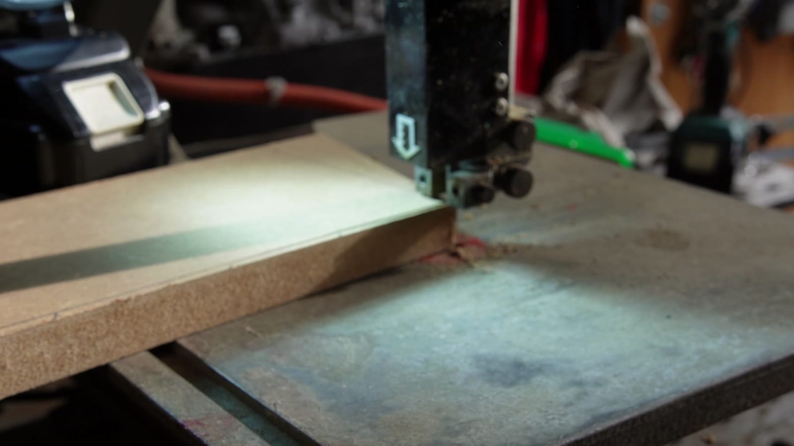 Cutting small wooden parts on a bandsaw.