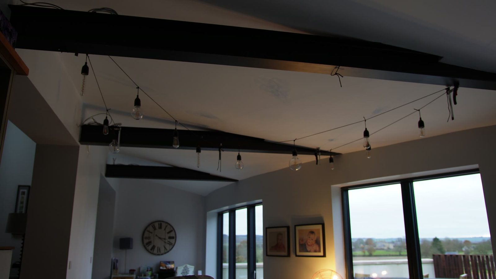 String lights installed across a room ceiling.
